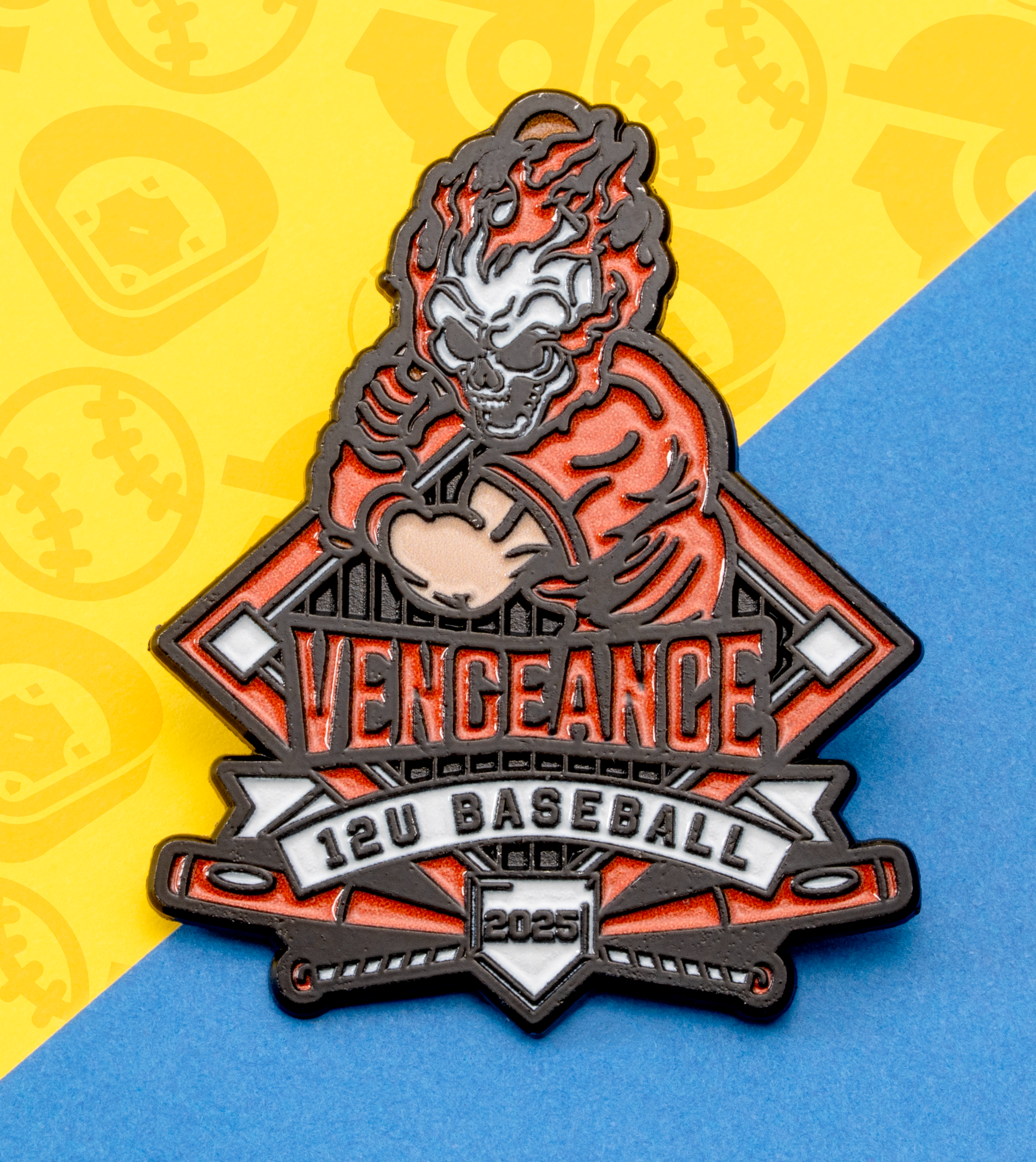 Enamel lapel pin featuring a flaming skull baseball player with the text Vengeance 12U Baseball 2025.